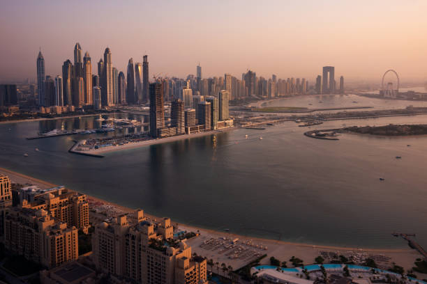 istock Dubai skyline on sunset, modern city with skyscrapers 1487310000