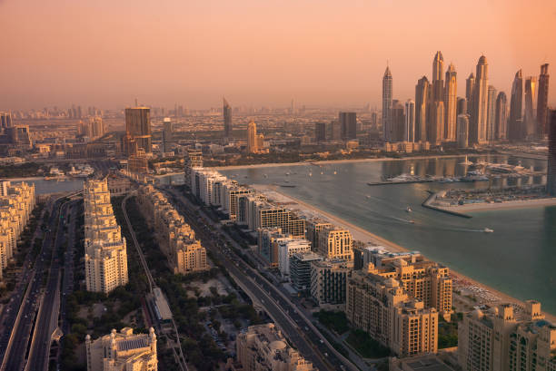 istock Dubai skyline on sunset, modern city with skyscrapers 1487310010