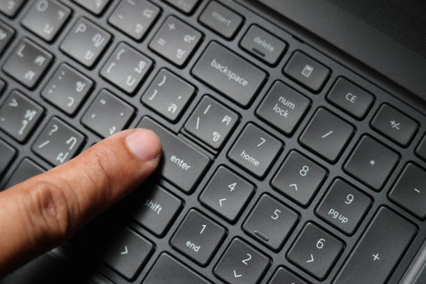 business man's finger operate key board, pushing key Enter on keyboard, Finger with a computer keyboard,Old man finger operate keyboard of computer