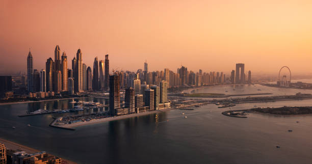 istock Dubai skyline on sunset, modern city with skyscrapers 1487310116