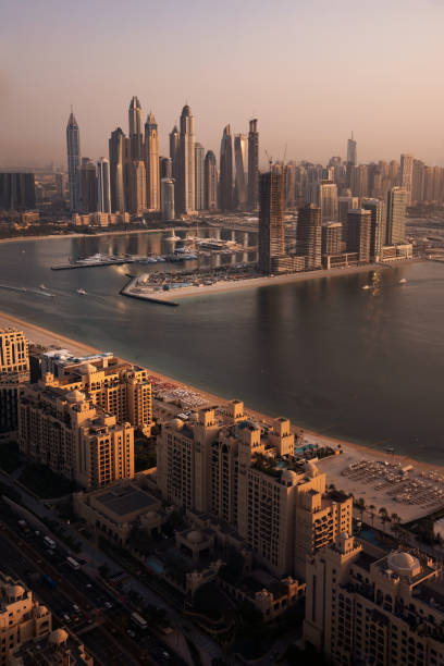 istock Dubai skyline on sunset, modern city with skyscrapers 1487310128