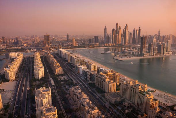 istock Dubai skyline on sunset, modern city with skyscrapers 1487310837