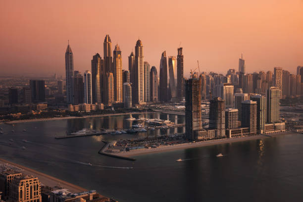 istock Dubai skyline on sunset, modern city with skyscrapers 1487310954