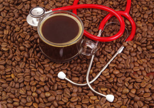 istock Cup of coffee with stethoscope on coffee beans. 1487311678