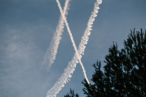 Airplane trails crossing in the sky