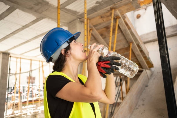 istock House construction construction worker woman drinking water taking a break 1487318149