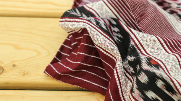 istock A traditional Indonesian fabric, namely batik cloth which has unique and different patterns and image motifs for each region. Cultural theme photos, typical of Asia. 1487319381
