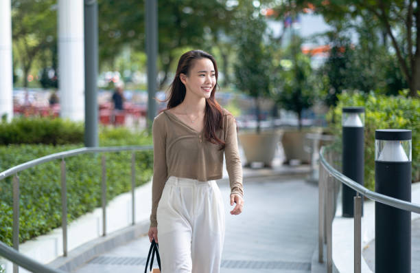 istock Young Chinese woman commuting to work 1487322974