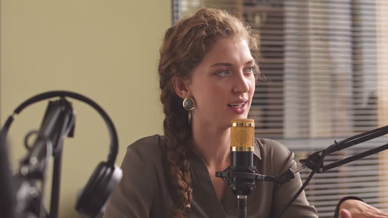 Young Woman Having Fun while Recording Podcast in Studio