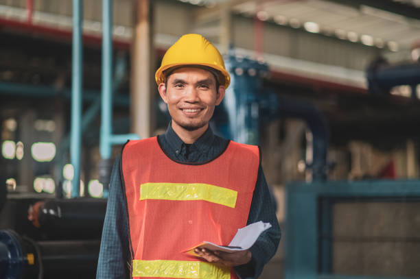 istock portrait of Asian man engineer construction concept, Asian man engineer in construction site, Worker in building construction site, worker helmet confident copy spec, worker in safety suit at work 1487323702