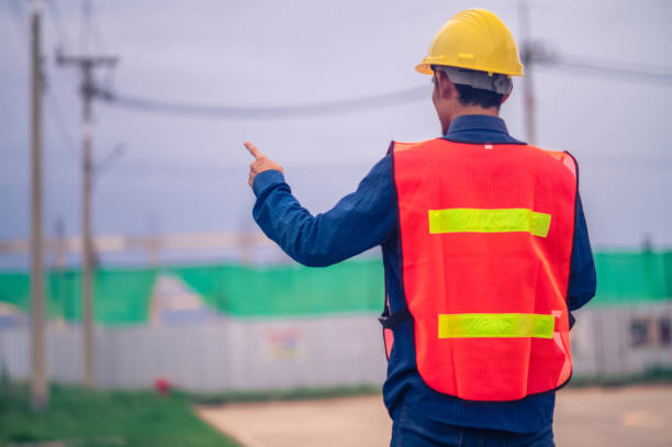 istock portrait of Asian man engineer construction concept, Asian man engineer in construction site, Worker in building construction site, worker helmet confident copy spec, worker in safety suit at work 1487323709