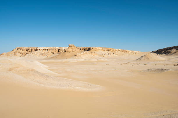 Landscape scenic view of desolate barren western desert in with geological mountain sandstone rock formations