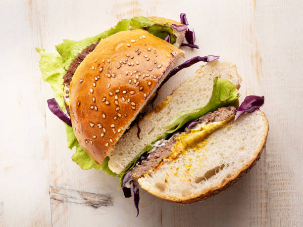 Hamburger, Hamburger on sesame seed bun with fixings, Homemade Hamburger on white Background stock photo