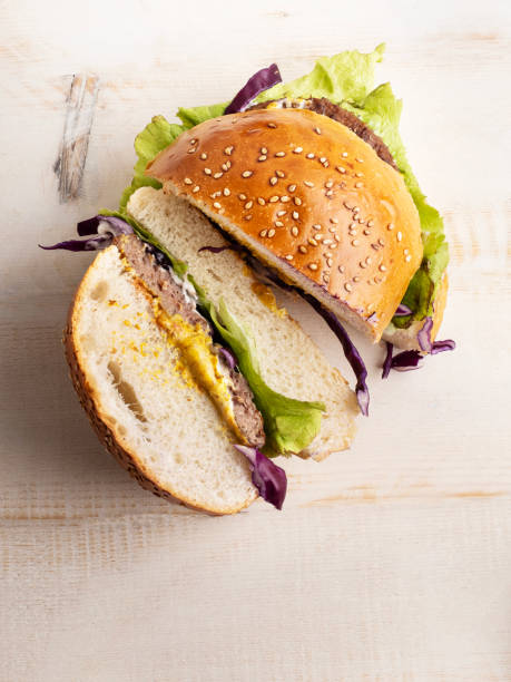 istock Hamburger, Hamburger on sesame seed bun with fixings, Homemade Hamburger on white Background 1487327445