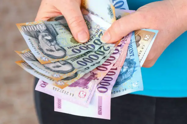 Hungarian forint money, Woman clutching a handful of banknotes, Large denominations, Inflation and financial situation in Hungary