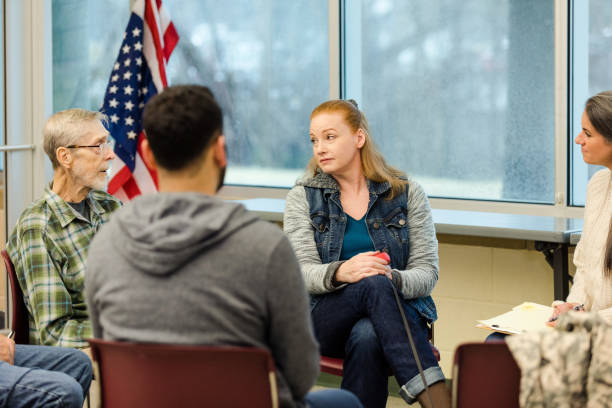 istock Diverse, multigenerational veteran's group meets for mutual support 1487328379