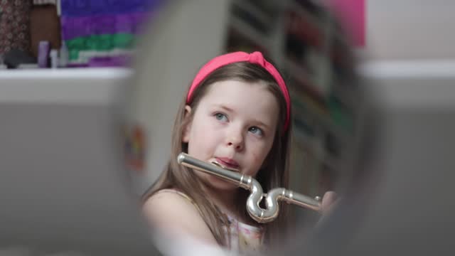 School Girl Plays Flute