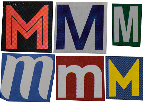 Letter M magazine cut out font, ransom letter, isolated collage elements for text alphabet, ransom note, hand made and cut from Old newspaper magazine cutouts, high quality scan.