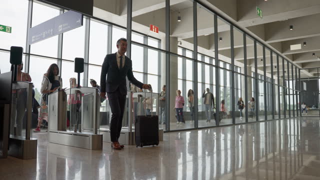 Passengers Scanning Boarding Passes at Airport Terminal