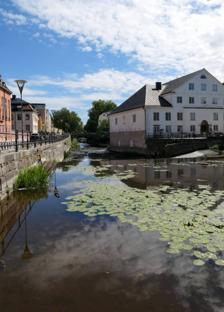 istock View of buildings by river against sky 1487330463