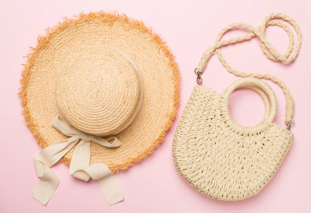 istock Straw hat and bag on color background, top view 1487331632