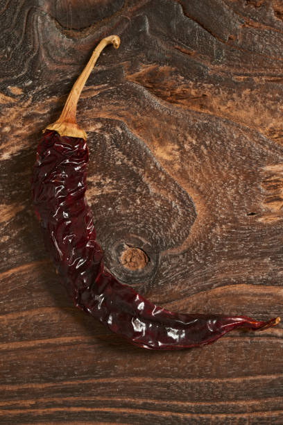 Dried green Pepper on Wooden background.