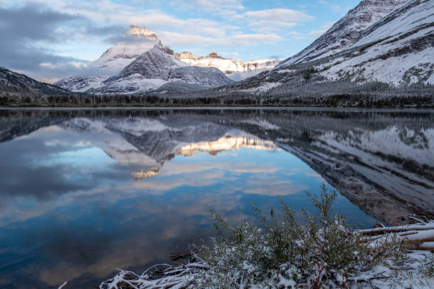 istock Mountain reflection early dawn after snow storm 1487336564