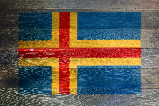 istock Aland islands flag on rustic old wood surface background 1487336722