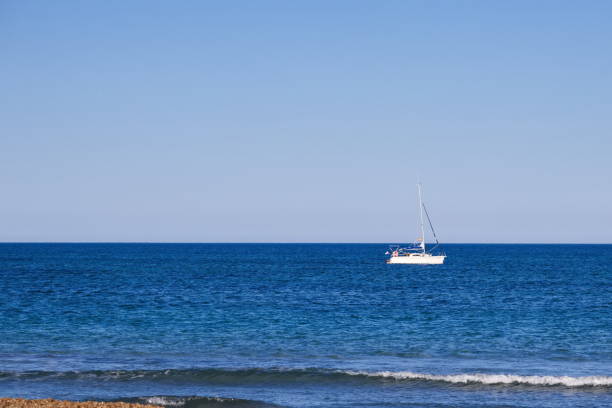 istock Nice seascape with boats going through the surf in vacation time 1487337916