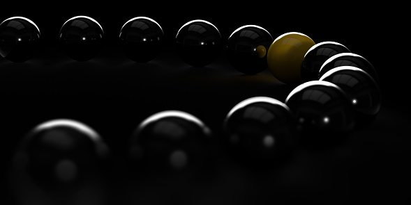 Being Unique, Leadership, Winning Strategy in Business Concept: Yellow ball standing out from the crowd of black shiny spheres. Dark presentation background, copy space. Difference, diversity, individuality, outstanding 3D illustration design template.
