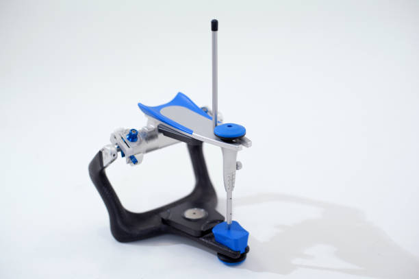 istock Articulator for teeth modeling. Dental articulators fixed dentures. Die-cast aluminum anatomical articulator. Dental equipment. Dentistry tools development of prostheses. Equipment dental prosthetist 1487339696