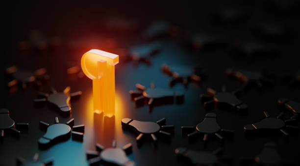 istock Yellow Paragraph Symbol Glowing Amid Black Lightbulb Symbols On Black Background 1487341878