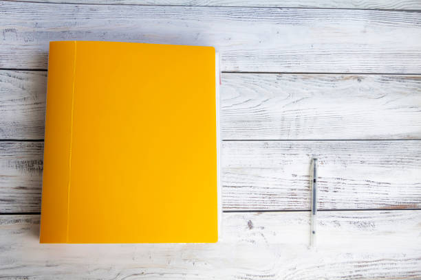istock Office supplies for work, sales and study on a wooden background. 1487344582