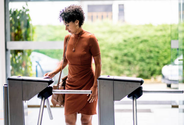 Young businesswoman entering her office building using a cardkey