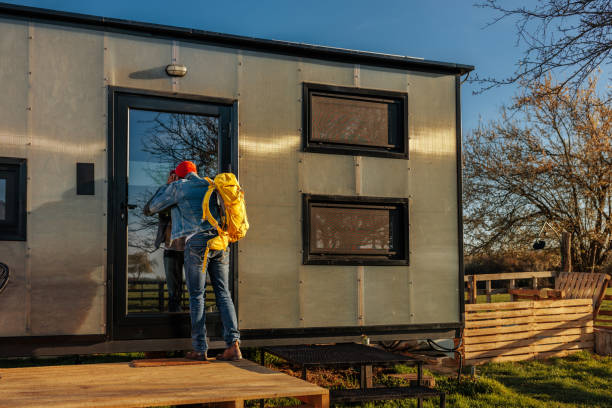 istock Young man arriving at vacation cabin. 1487351197