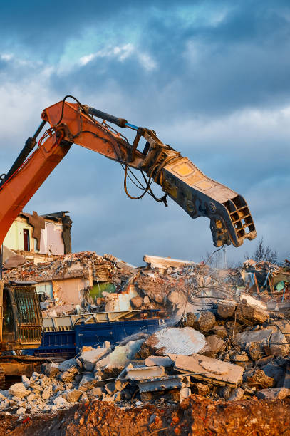 istock Machine with crusher operates with reinforced concrete 1487353090