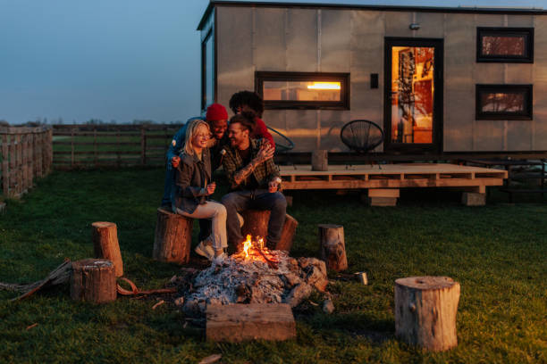 istock Cheerful couples bonding at campsite. 1487353166