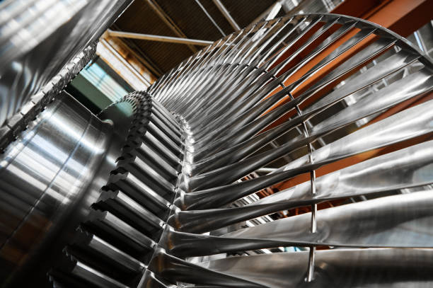 istock Shiny rotor of powerful steam turbine in light workshop 1487353272
