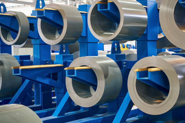 istock Large rolls of electrical transformer steel hang on rack 1487353311