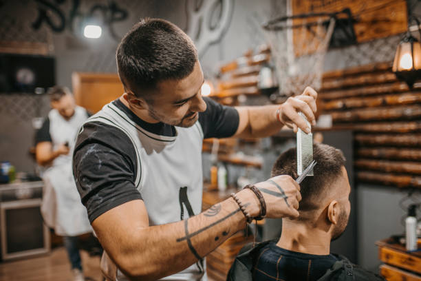 istock Two young male clients in a barber shop 1487353731