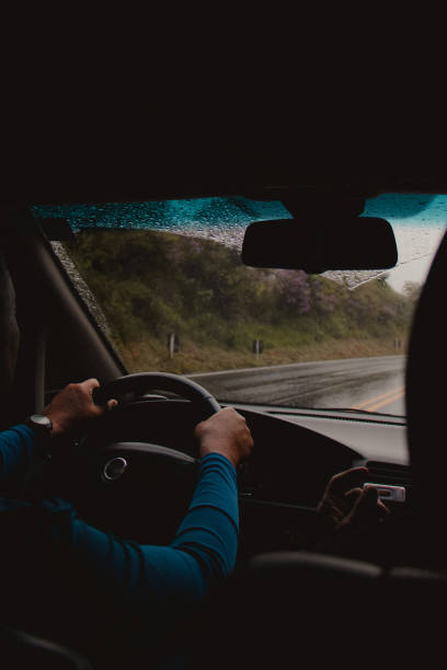 person driving during the rain