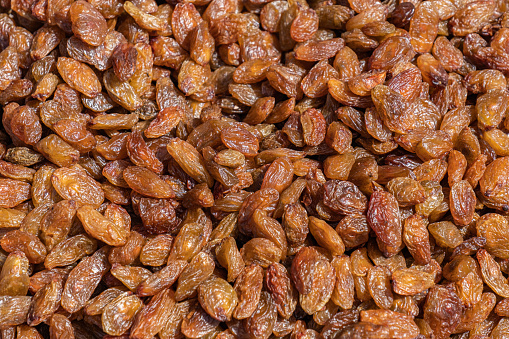 Raisin texture, full frame photo background. Dried Grapes.