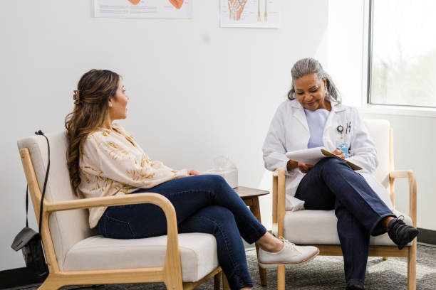 istock Mental health therapist makes notes while the female patient talks 1487357405