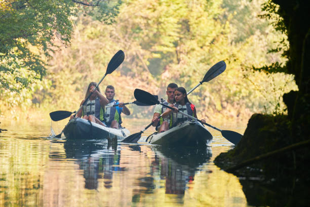 istock A group of friends enjoying having fun and kayaking while exploring the calm river, surrounding forest and large natural river canyons 1487357526