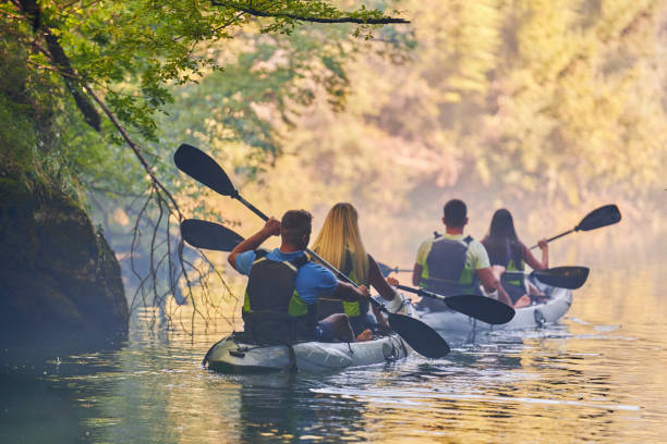 istock A group of friends enjoying having fun and kayaking while exploring the calm river, surrounding forest and large natural river canyons 1487358104