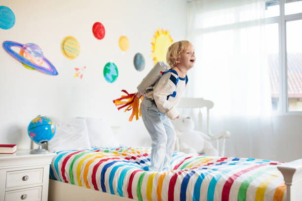 istock Kids play astronaut. Space and planet child game. 1487358290