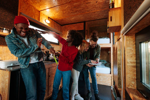 istock Playful friends in vacation cabin. 1487359285