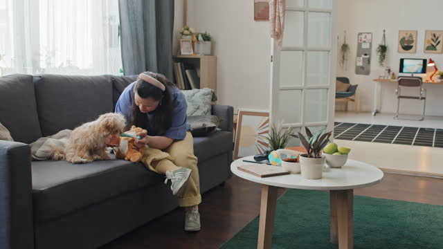 Woman With Down Syndrome And Her Dog At Home