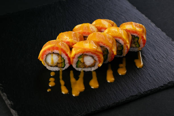 istock fresh japans sushi on a black background 1487359702