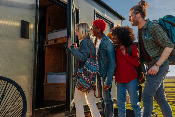 istock Joyful friends arriving at weekend vacation destination. 1487359749